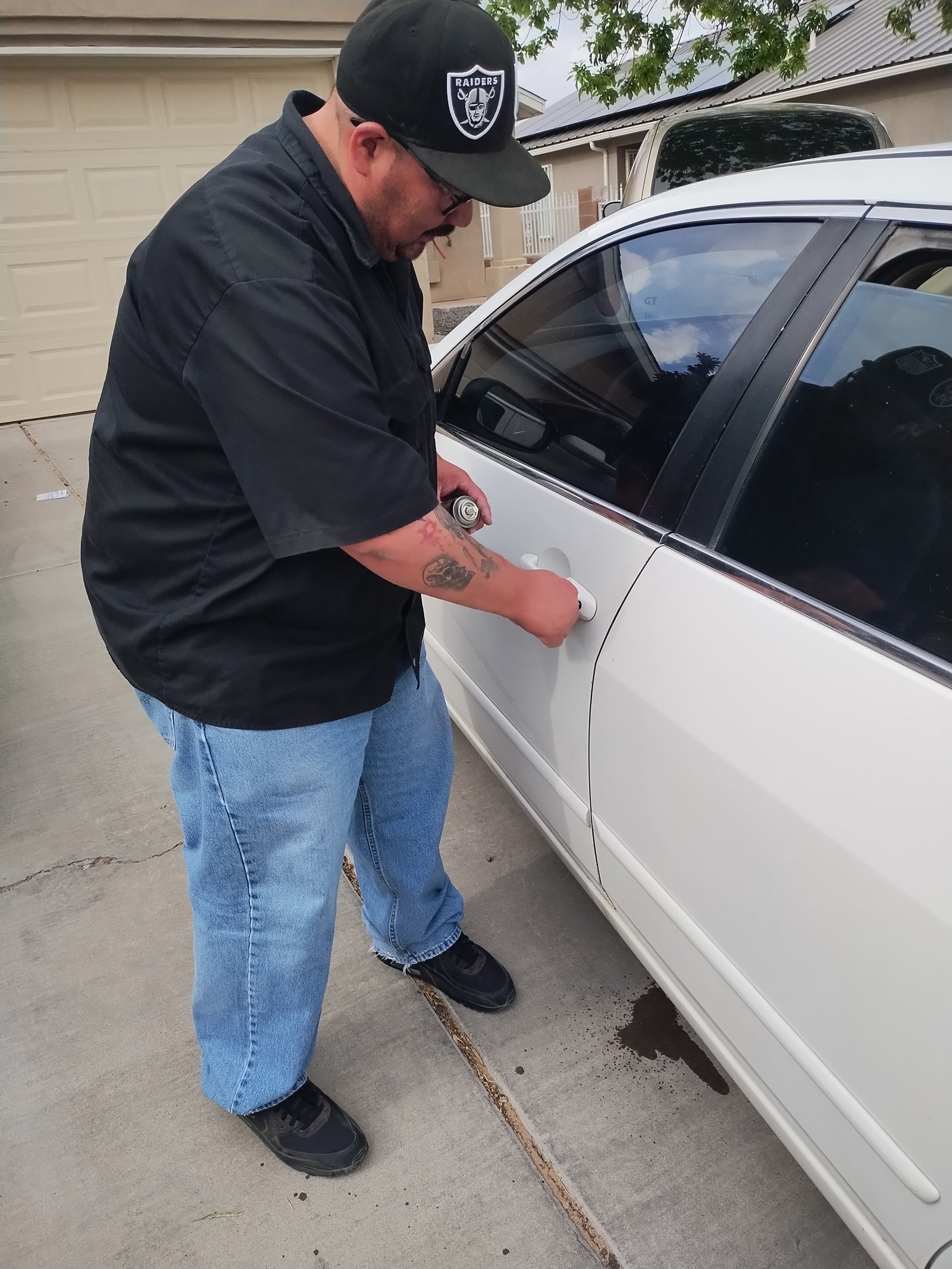 Unlocking sedan during car lockout service in Albuquerque