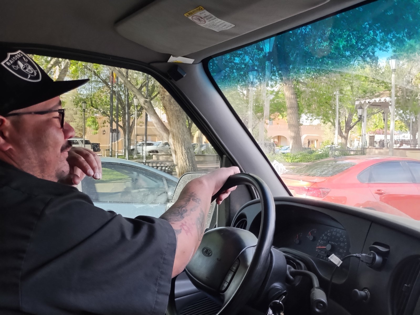 Justin driving the locksmith van through Old Town Albuquerque