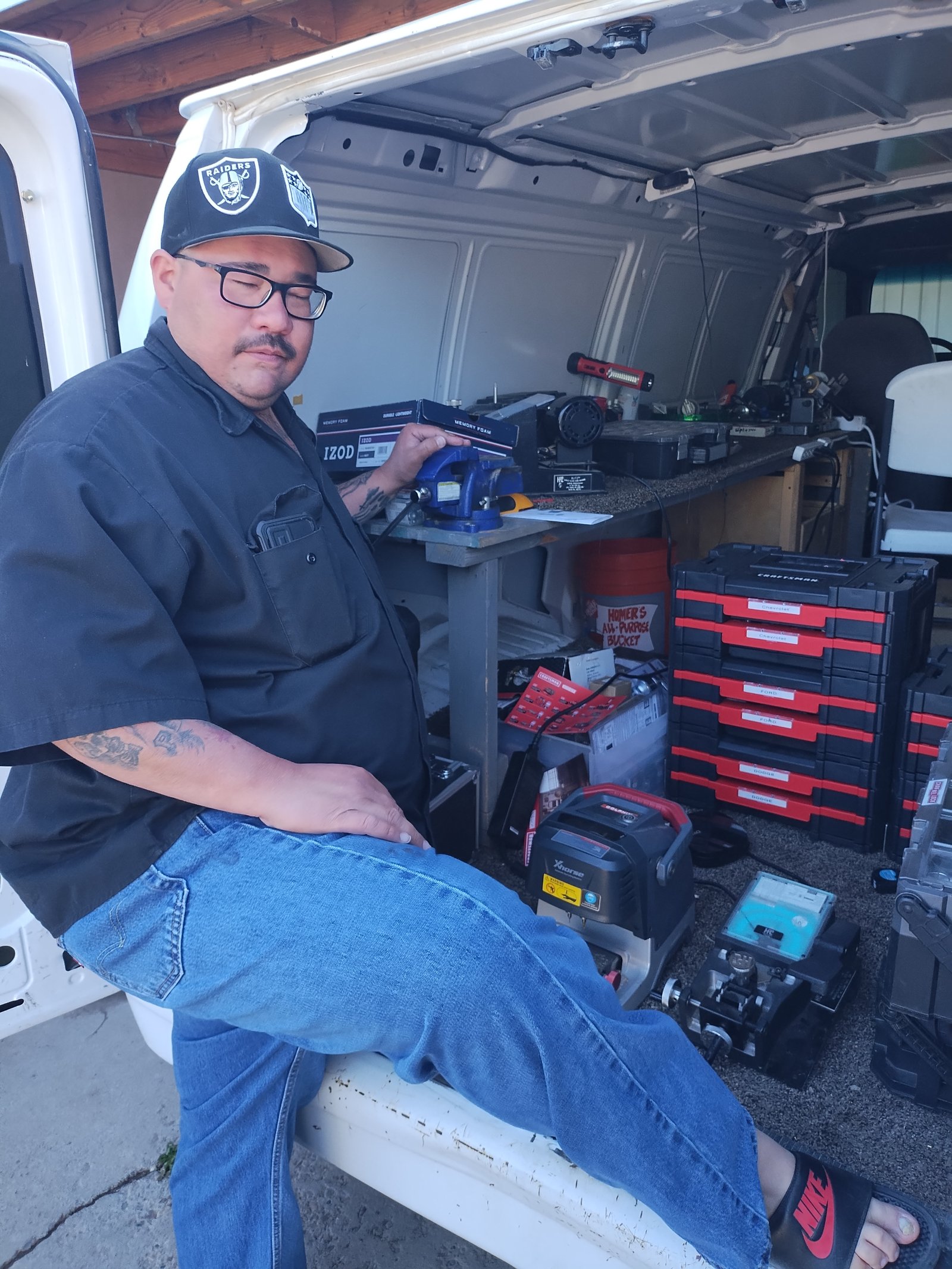 Justin in the service van with locksmith tools