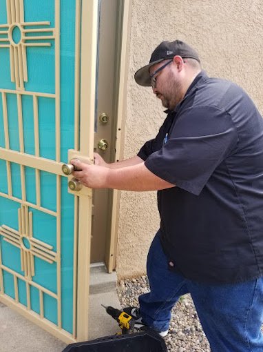 Just In Time Locksmith rekeying a residential door lock in Albuquerque